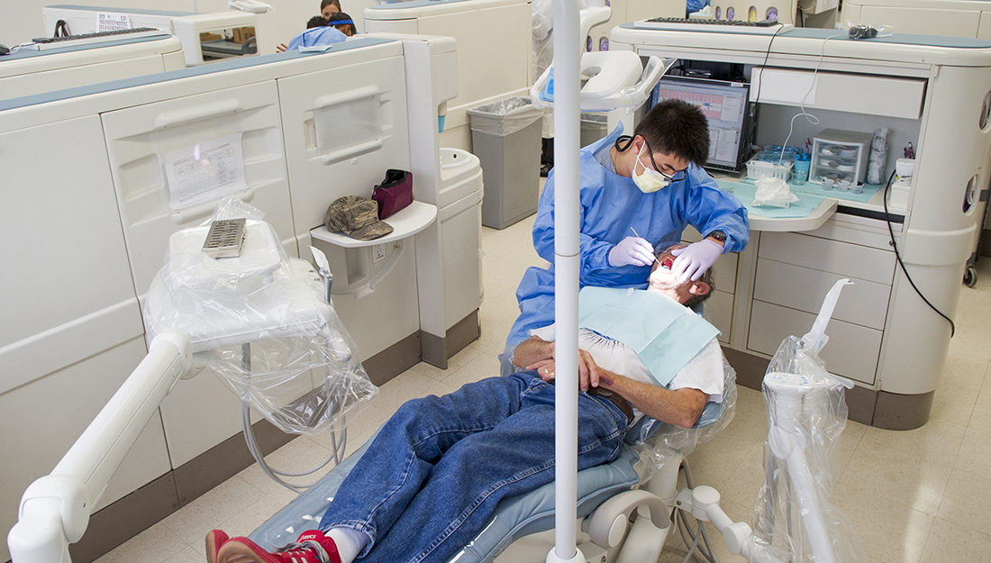 dentist-working-with-patient-in-clinic