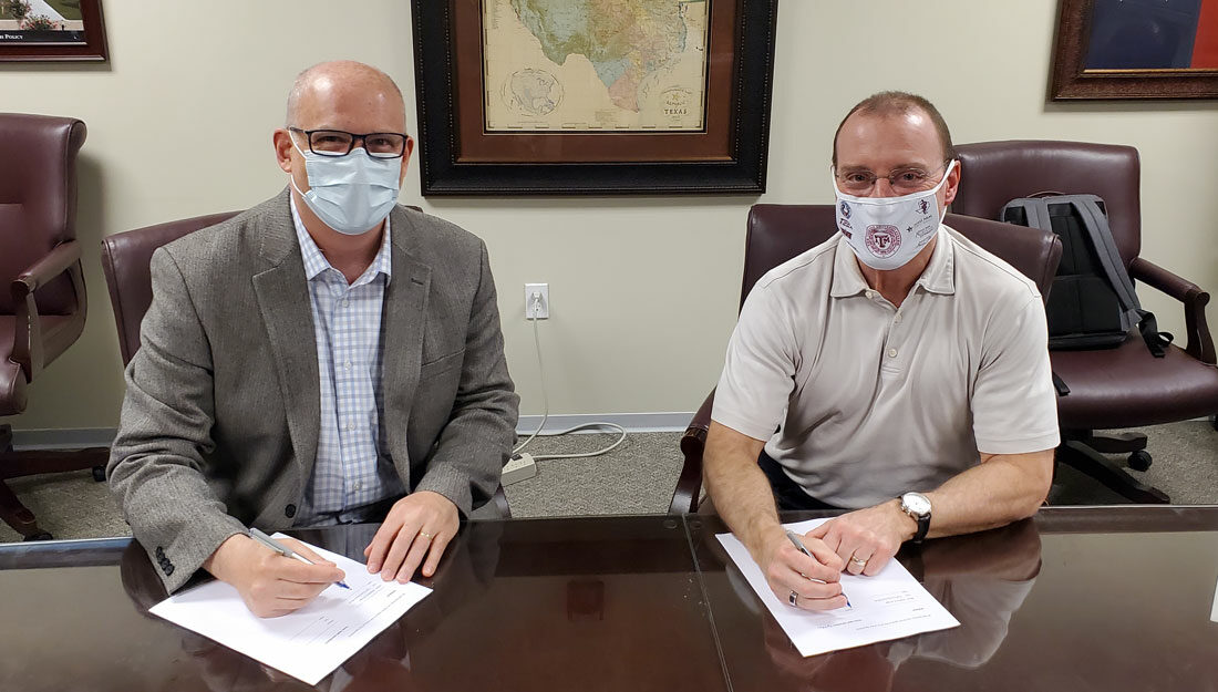 Jon Mogford, Texas A&M System Vice Chancellor for Research, and Andrew Arrage, Chief Commercial Officer for Matica Bio, sign master research agreement
