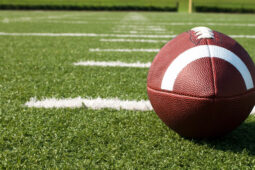Closeup of American football on field