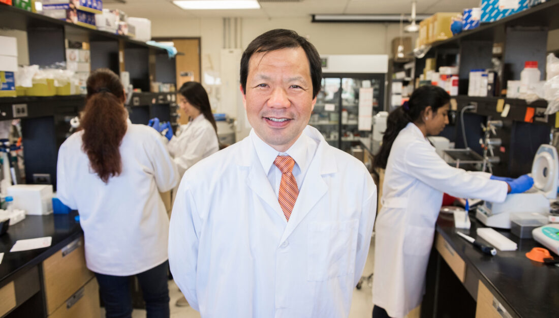 Dr Koichi Kobayashi stands in his research lab