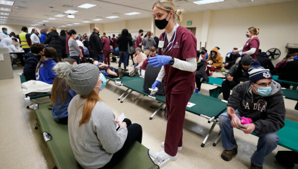 students work in a field hospital to care for "patients"