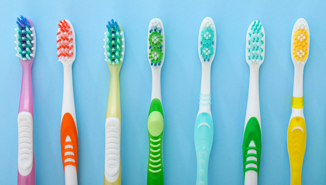 multiple manual toothbrushes lined up