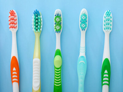 multiple manual toothbrushes lined up
