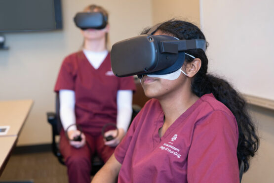 Texas A&M nursing students wear virtual reality goggles as they take part in a clinical simulation
