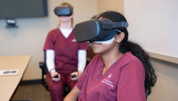 Texas A&M nursing students wear virtual reality goggles as they take part in a clinical simulation